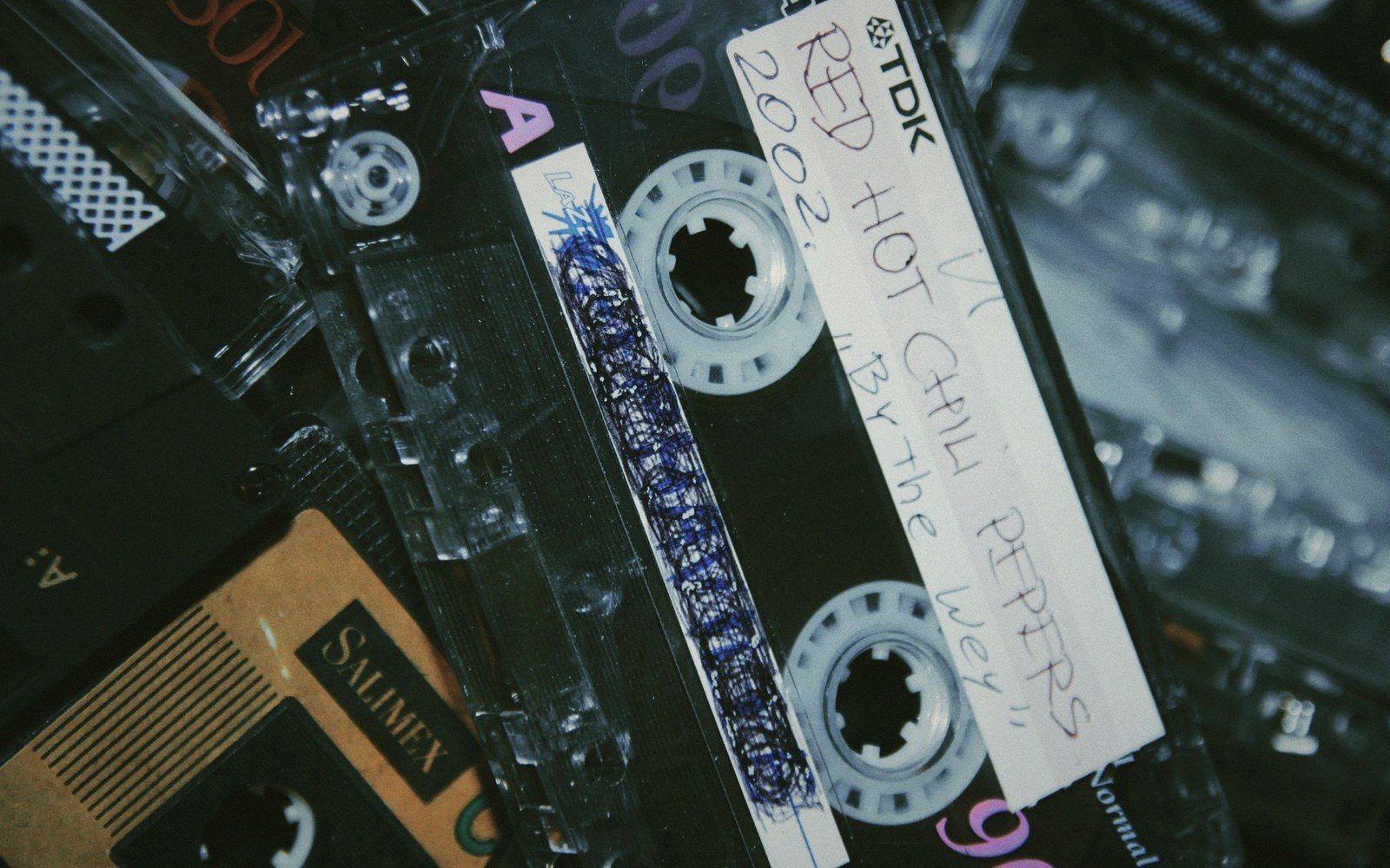A hand-labeled cassette tape with a handwritten Red Hot Chili Peppers tracklist
